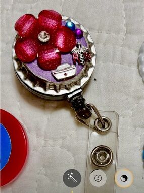 Handmade Floral Badge Reel with pink Flower and nurse specific charms.